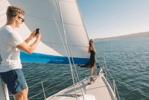 couple-taking-photograph-on-sailboat-san-diego-ba-2023-11-27-05-27-56-utc-1.jpg
